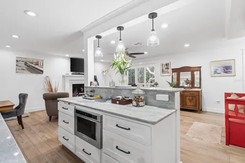 a living room with furniture fireplace and flat screen tv