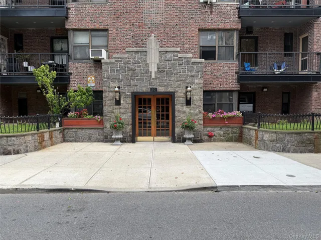a building with potted plants in front of it
