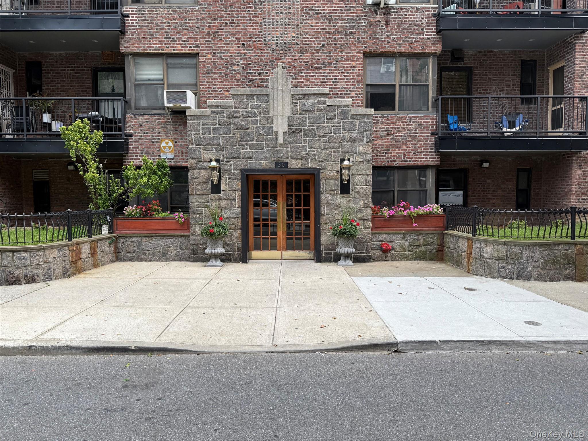 a building with potted plants in front of it