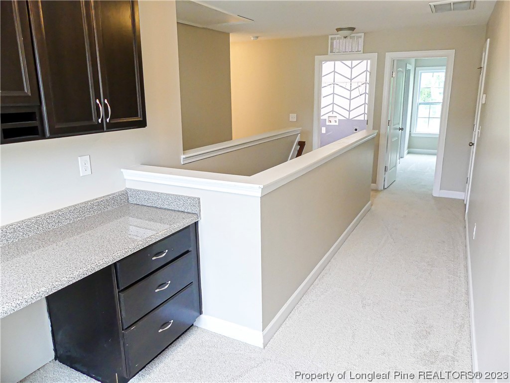 80 Pedley Place Cameron, NC 28326 - Photo 18 of 34 a hallway with cabinet and window