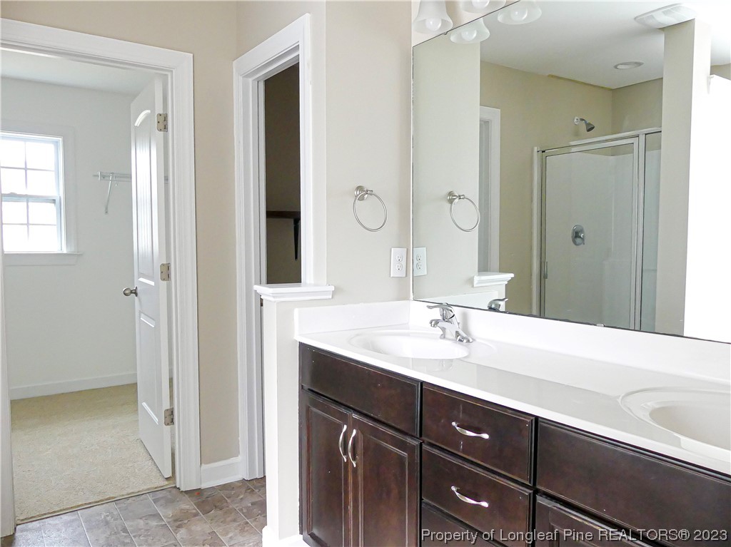 80 Pedley Place Cameron, NC 28326 - Photo 24 of 34 a bathroom with a sink and a mirror
