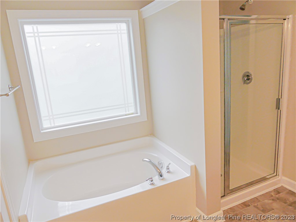 80 Pedley Place Cameron, NC 28326 - Photo 26 of 34 a white bath tub sitting next to a shower