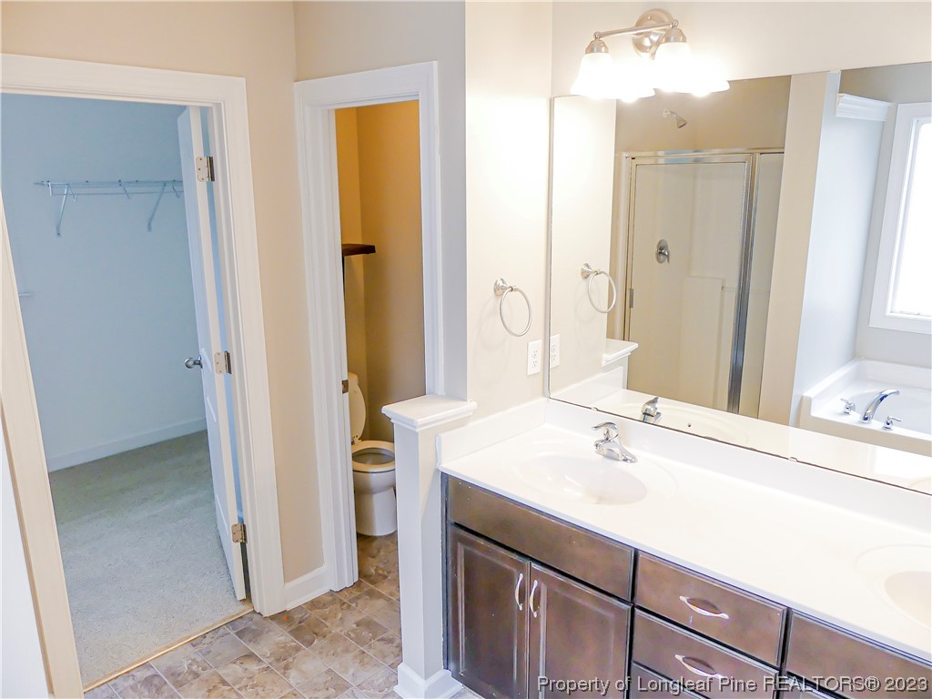 80 Pedley Place Cameron, NC 28326 - Photo 28 of 34 a bathroom with a sink vanity granite tub and shower