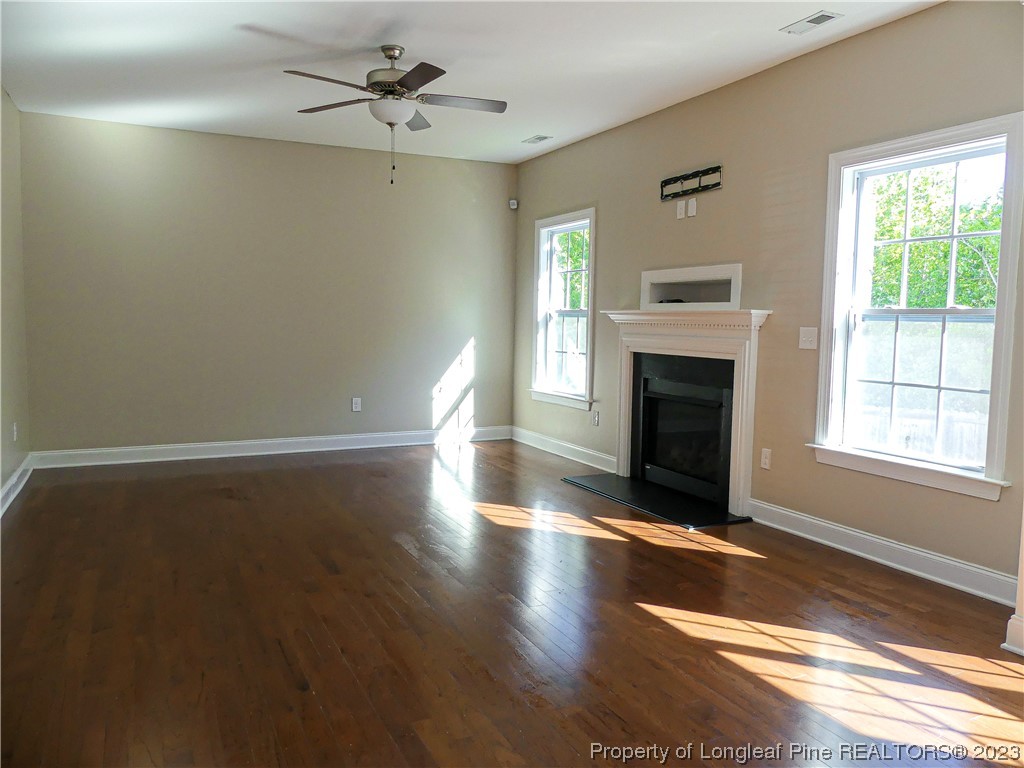80 Pedley Place Cameron, NC 28326 - Photo 6 of 34 an empty room with windows and fireplace