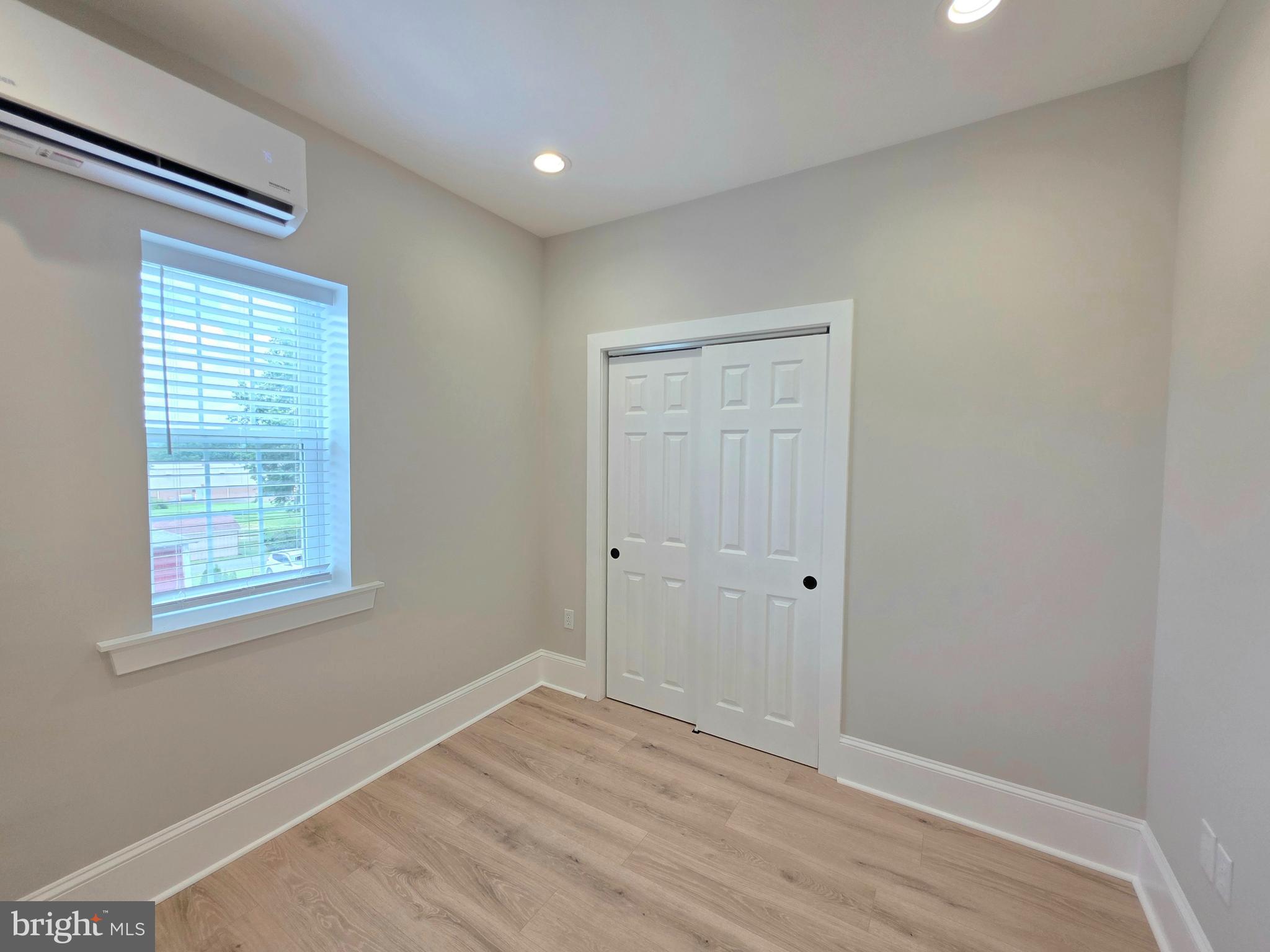 9 East Reliance Road Souderton, PA 18964 - Photo 12 of 16 a view of an empty room with wooden floor and a window