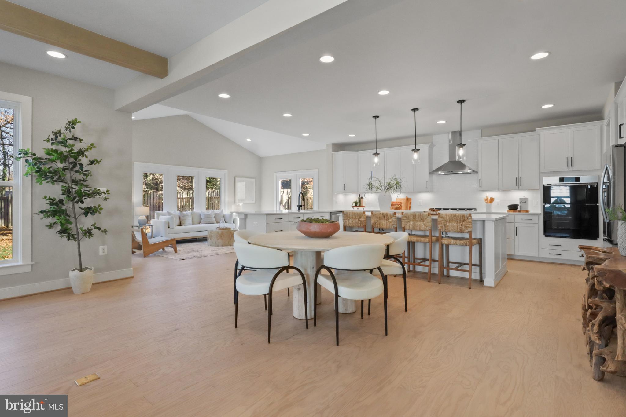 602 Kingsley Road Southwest Vienna, VA 22180 - Photo 20 of 79 a large kitchen with a table and chairs in it