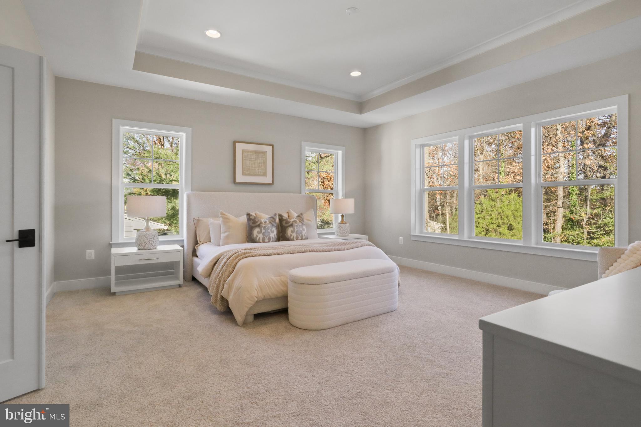 602 Kingsley Road Southwest Vienna, VA 22180 - Photo 32 of 79 a spacious bedroom with a bed and a large window