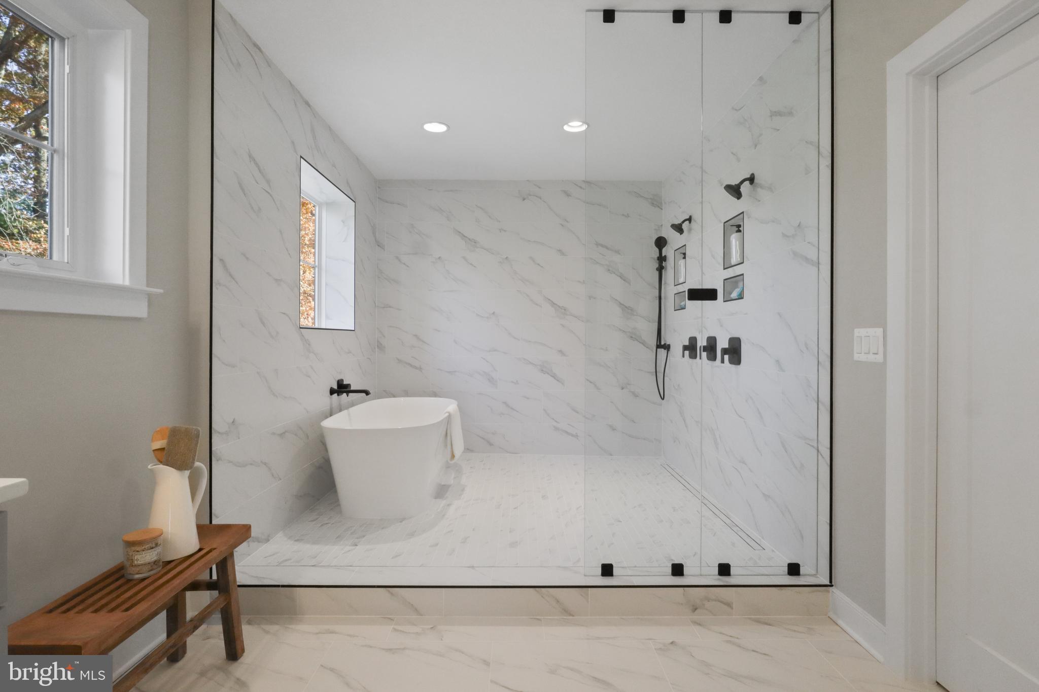 602 Kingsley Road Southwest Vienna, VA 22180 - Photo 35 of 79 a bathroom with a bathtub and a toilet