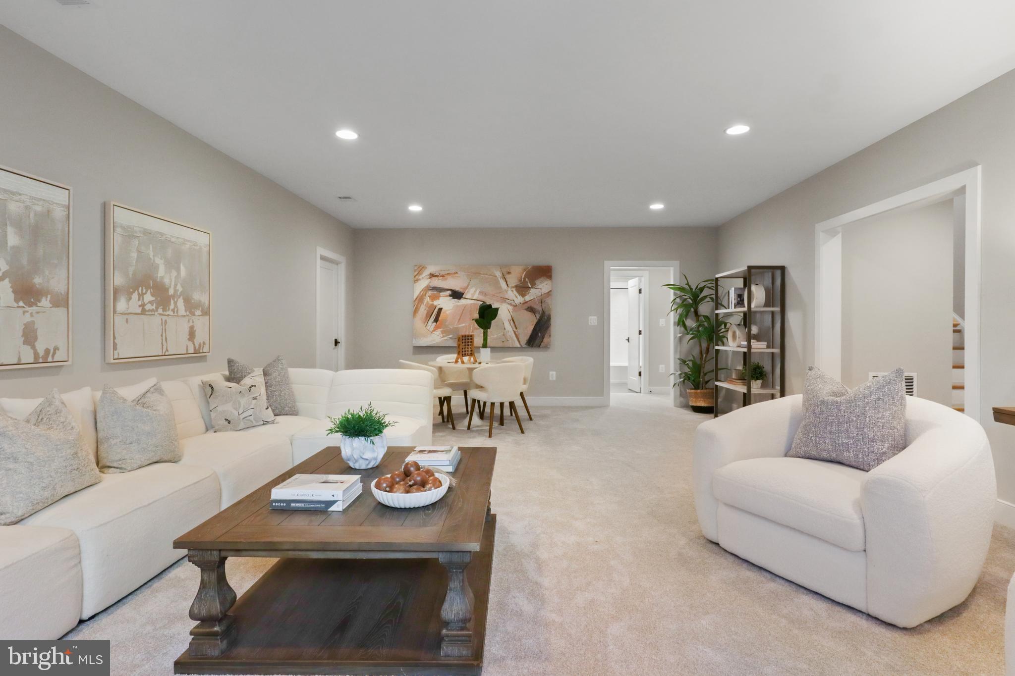 602 Kingsley Road Southwest Vienna, VA 22180 - Photo 55 of 79 a living room with furniture and wooden floor