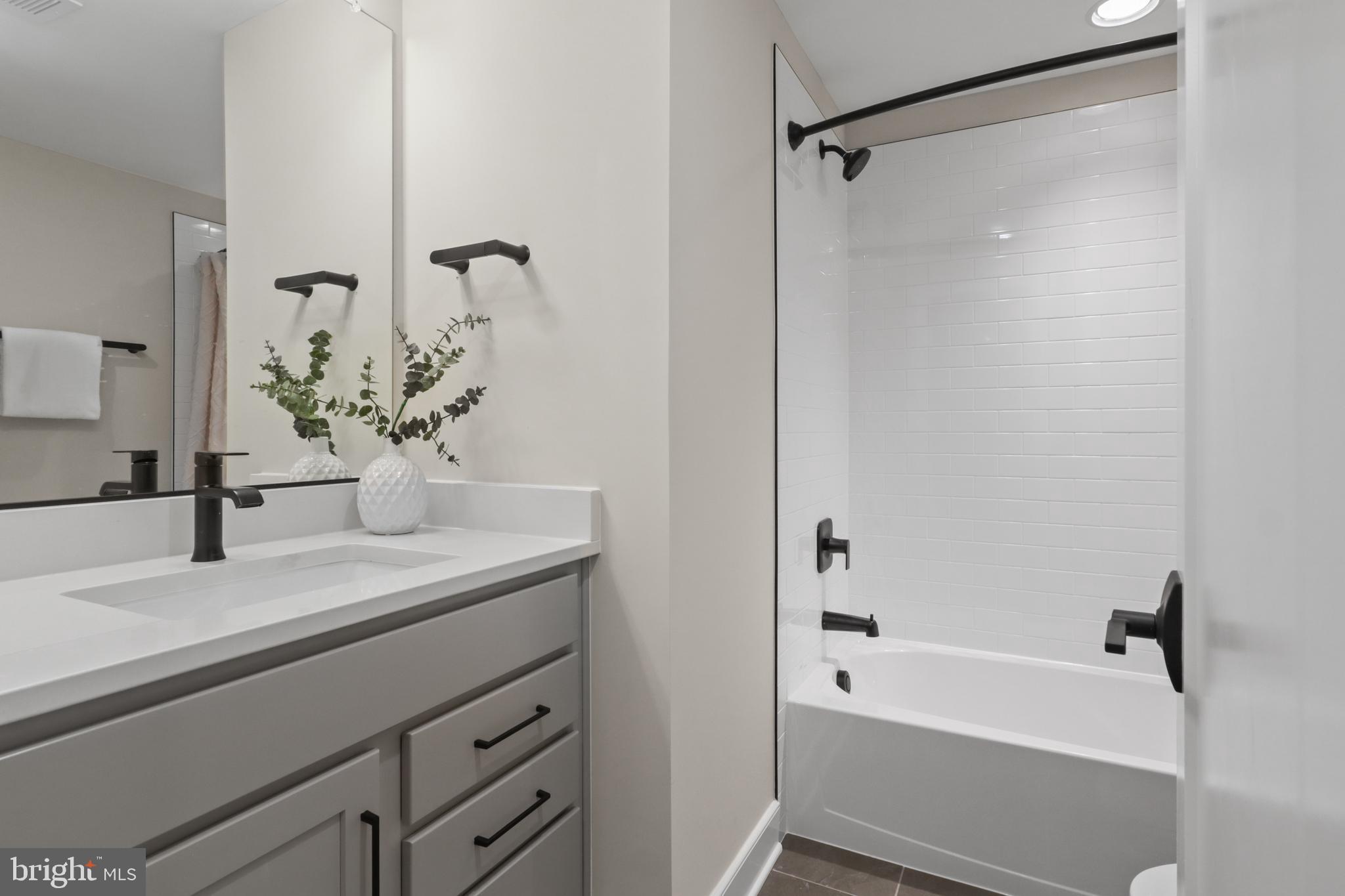 602 Kingsley Road Southwest Vienna, VA 22180 - Photo 57 of 79 a bathroom with a bathtub and a sink