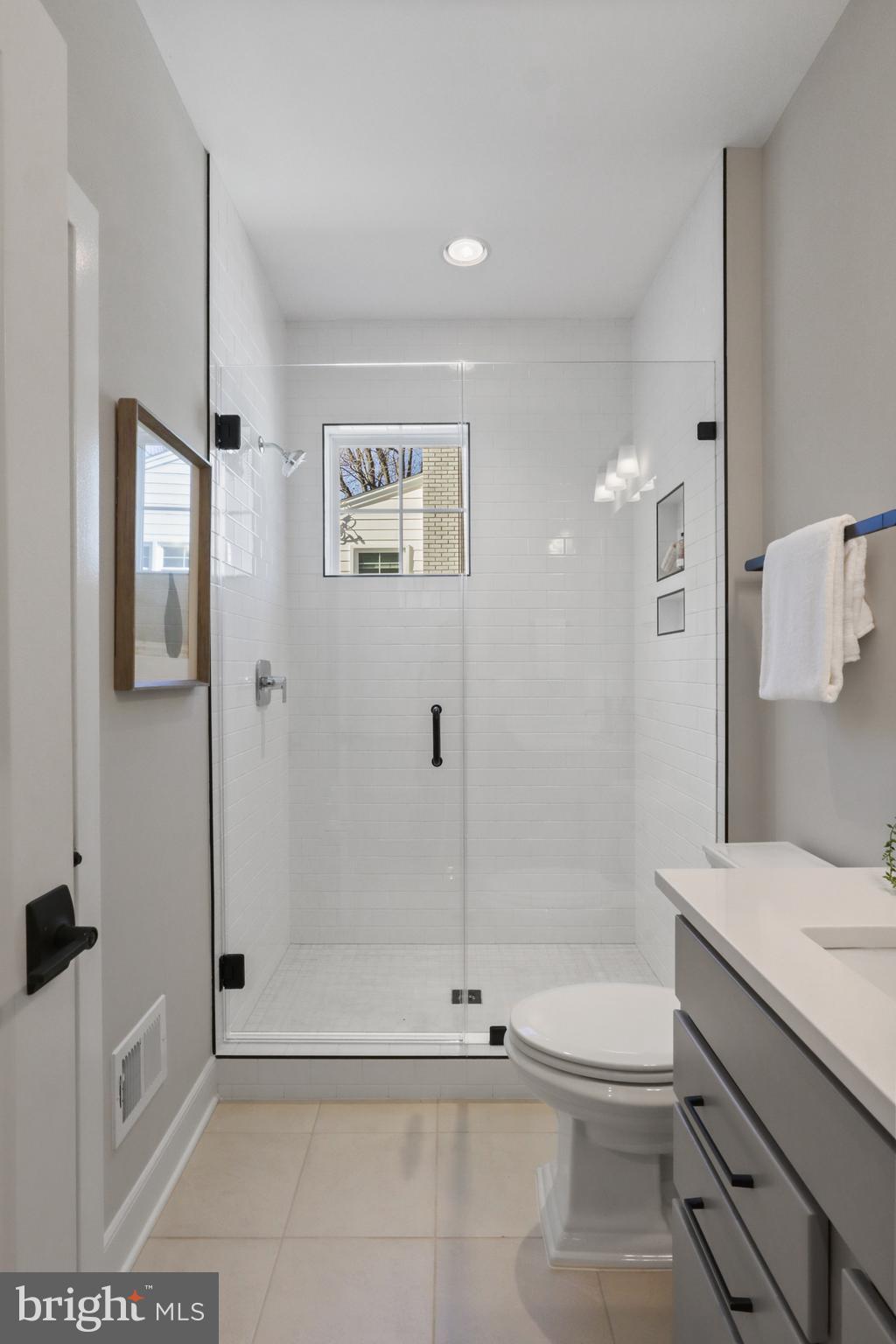 602 Kingsley Road Southwest Vienna, VA 22180 - Photo 59 of 79 a bathroom with a granite countertop sink a toilet and shower