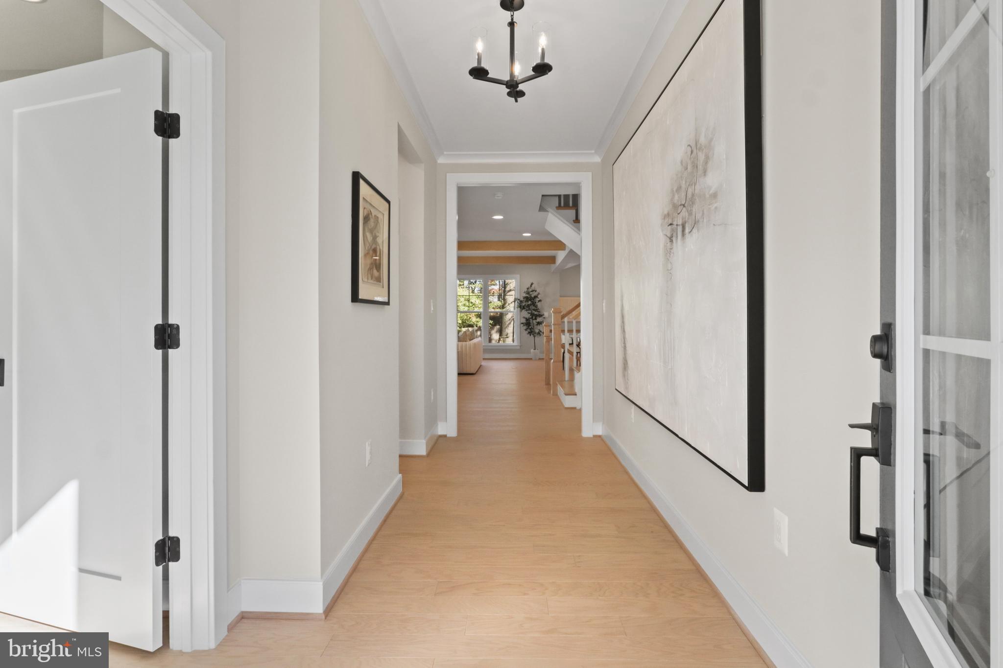 602 Kingsley Road Southwest Vienna, VA 22180 - Photo 7 of 79 a view of a hallway view with wooden floor and staircase