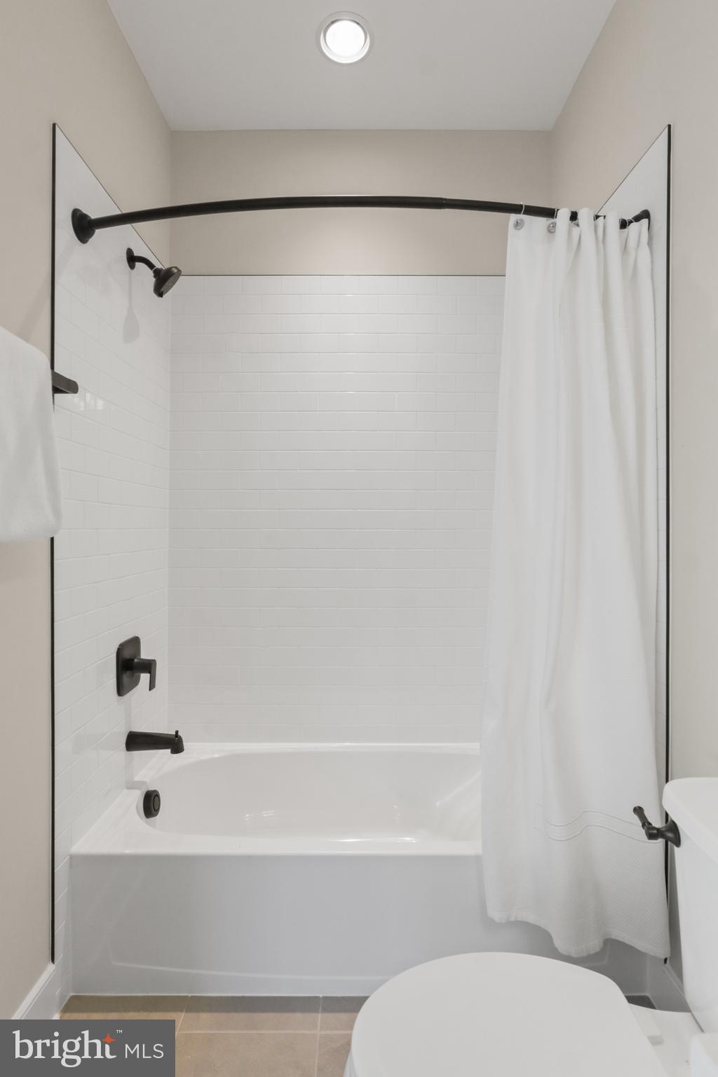 602 Kingsley Road Southwest Vienna, VA 22180 - Photo 73 of 79 a bathroom with a shower and a tub