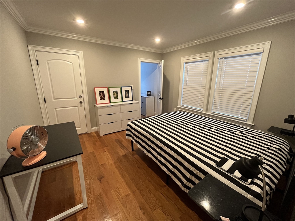 23 Rockledge Street, Unit 1 Boston, MA 02119 - Photo 5 of 8 a bedroom with furniture and a window