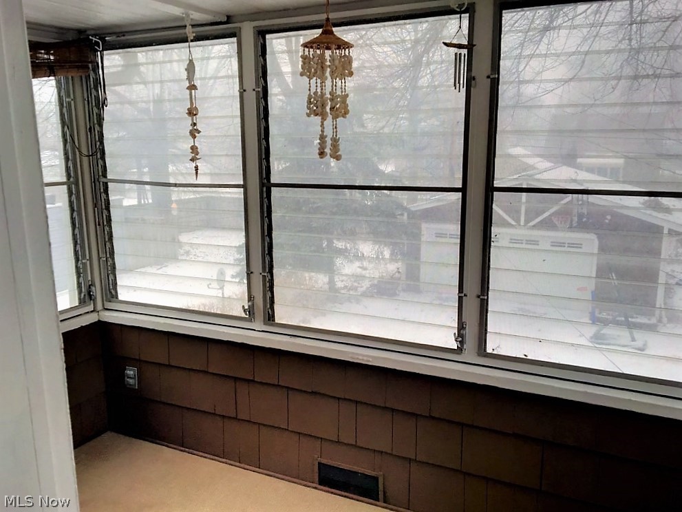 3775 Lowell Road Cleveland Heights, OH 44121 - Photo 20 of 23 Enclosed upstairs porch provide a nice quiet spot for reading.