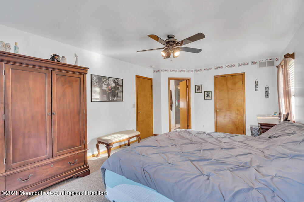 587 Reed Road Jackson, NJ 08527 - Photo 11 of 26 a bedroom with a bed and a window