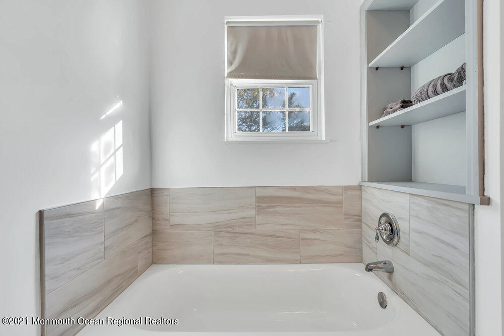 587 Reed Road Jackson, NJ 08527 - Photo 13 of 26 a bathroom with a bathtub