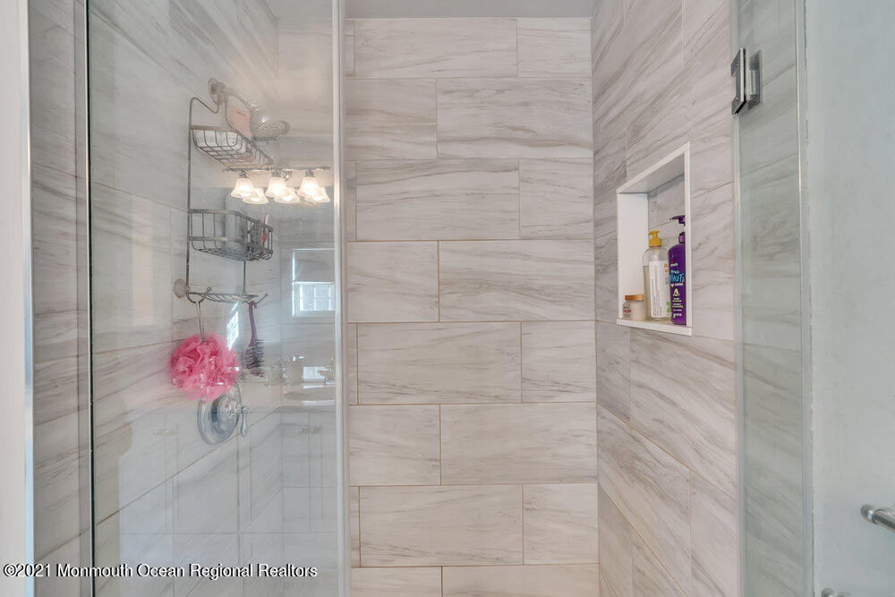 587 Reed Road Jackson, NJ 08527 - Photo 14 of 26 a bathroom with a shower