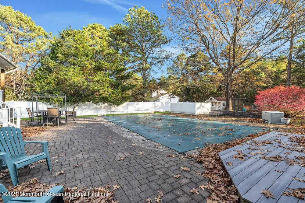 587 Reed Road Jackson, NJ 08527 - Photo 22 of 26 a view of a yard with plants and trees