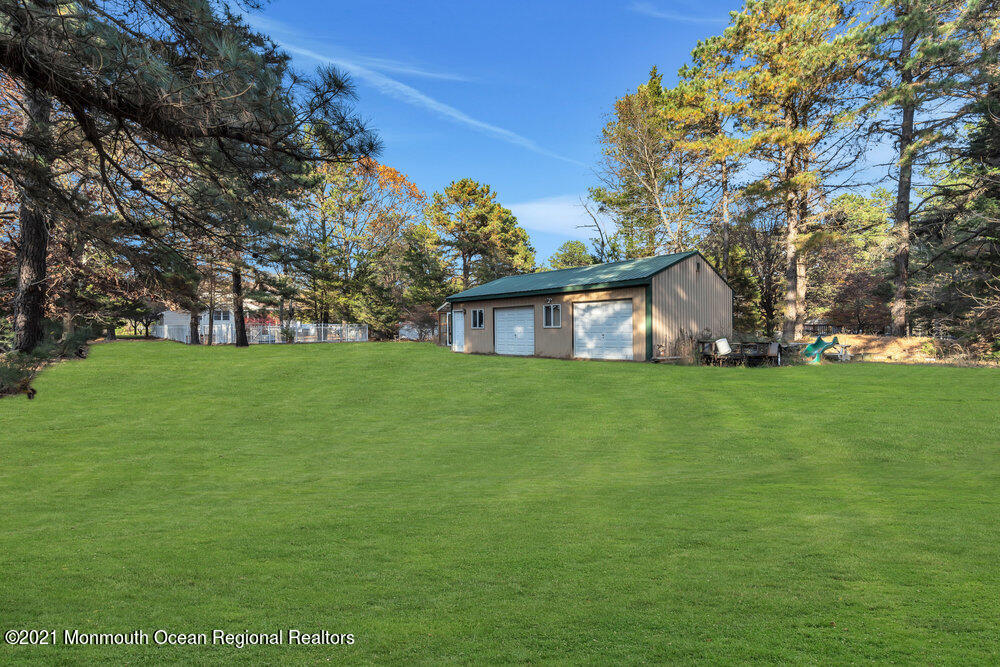 587 Reed Road Jackson, NJ 08527 - Photo 25 of 26 a view of house that has a big yard