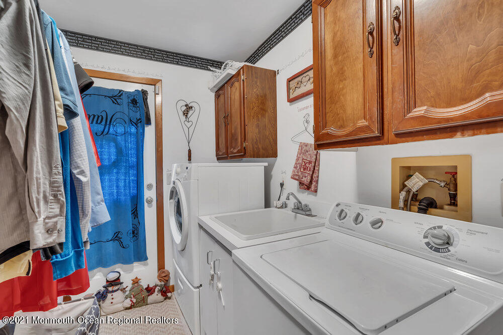 587 Reed Road Jackson, NJ 08527 - Photo 9 of 26 a bathroom with a sink and a mirror