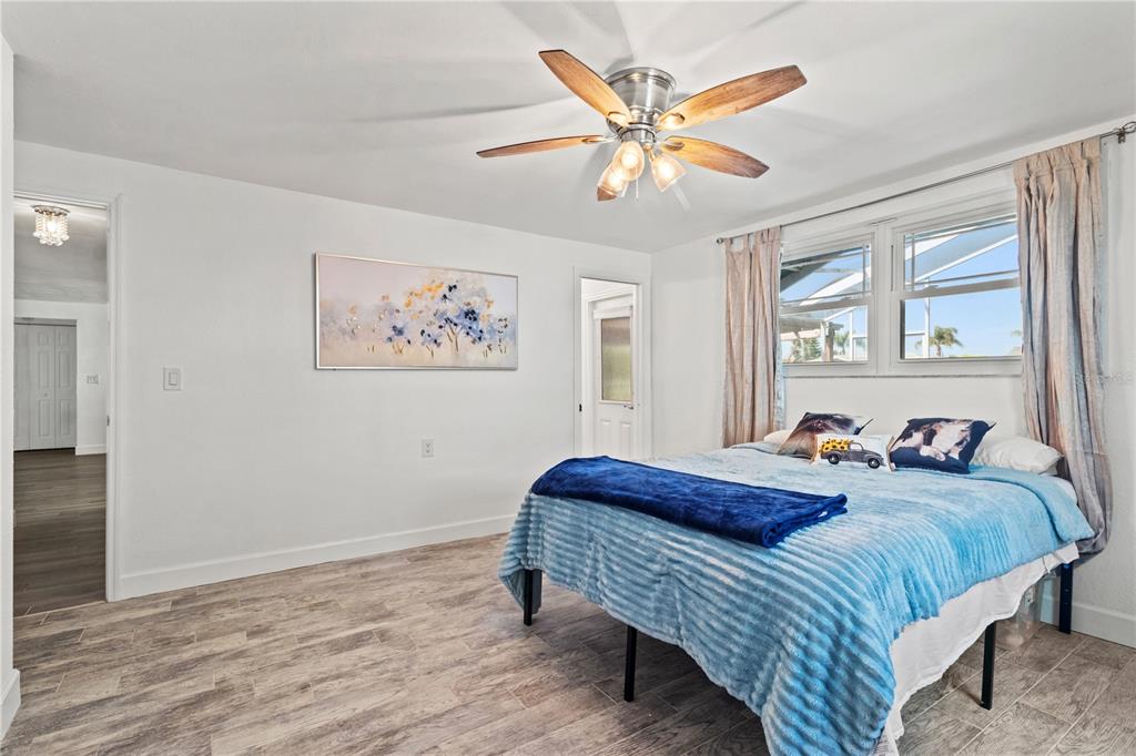 9917 San Sierra Way Port Richey, FL 34668 - Photo 16 of 33 a bedroom with bed and a window