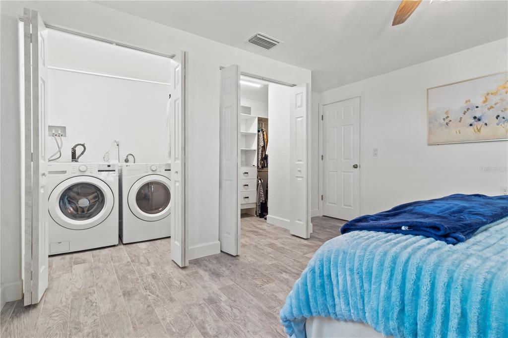 9917 San Sierra Way Port Richey, FL 34668 - Photo 20 of 33 a bedroom with a bed and cabinets