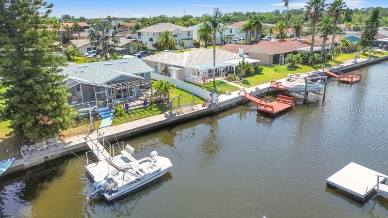 9917 San Sierra Way Port Richey, FL 34668 - Photo 28 of 33 an aerial view of a house with a lake view