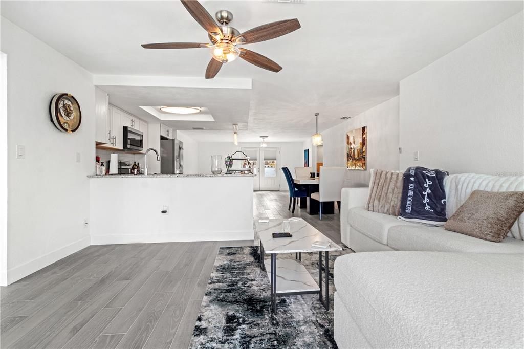 9917 San Sierra Way Port Richey, FL 34668 - Photo 8 of 33 a living room with furniture and a wooden floor