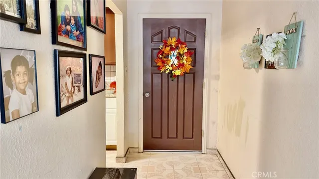 a view of a dry yard with wooden fence