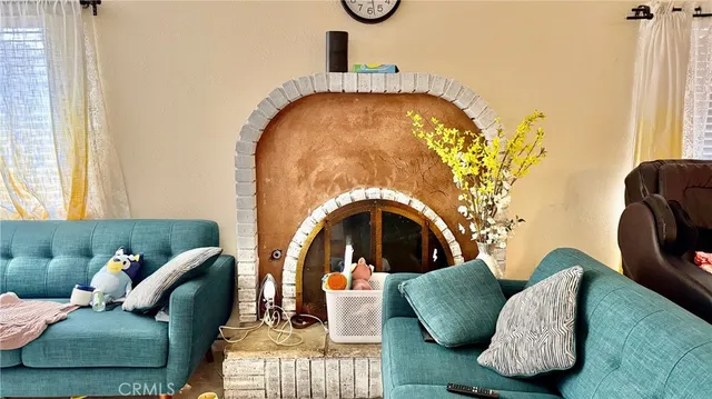 a kitchen with granite countertop lots of clutter and stainless steel appliances