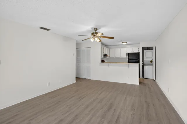 a view of a kitchen with wooden floor