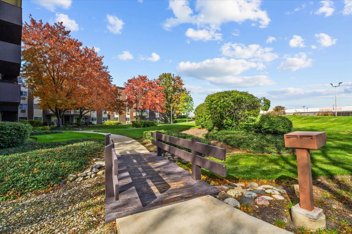 1311 South Finley Road, Unit 203 Lombard, IL 60148 - Photo 20 of 20 a front view of a house with garden