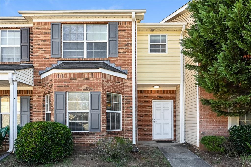1574 Eastern Sunrise Lane Decatur, GA 30034 - Photo 1 of 1 a front view of a house with a yard