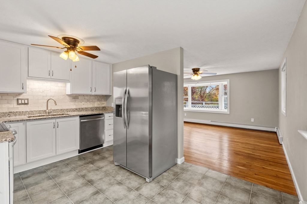 130 Old Barnstable Road Falmouth, MA 02536 - Photo 12 of 38 a kitchen with granite countertop a refrigerator and a sink
