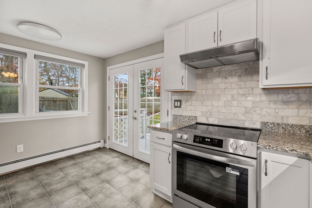 130 Old Barnstable Road Falmouth, MA 02536 - Photo 14 of 38 a kitchen with stainless steel appliances a stove and a refrigerator