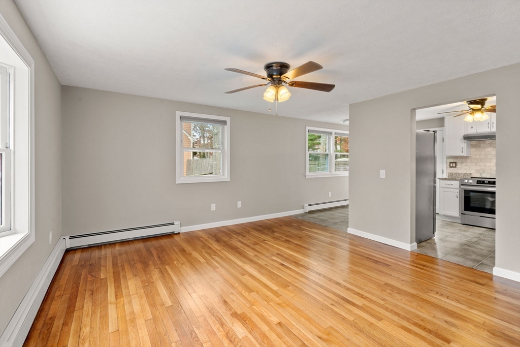 130 Old Barnstable Road Falmouth, MA 02536 - Photo 9 of 38 a view of empty room with wooden floor and fan
