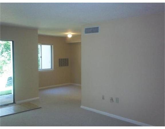 7 Beal's Cove Road, Unit 7G Hingham, MA 02043 - Photo 7 of 12 an empty room with windows