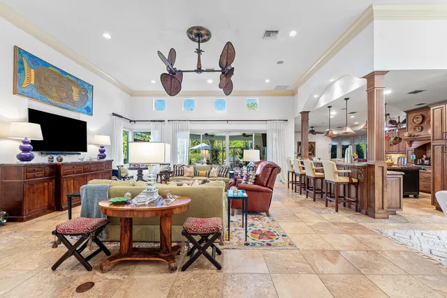 a living room with lots of furniture and a flat screen tv