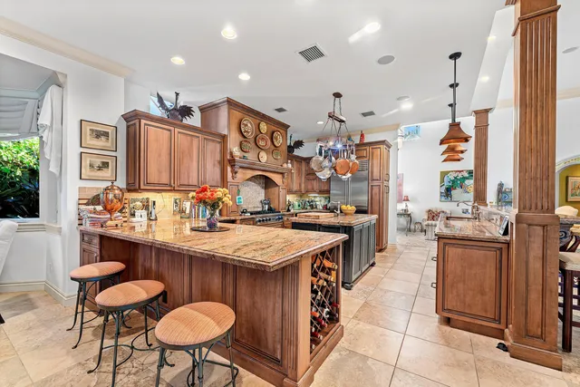 a large kitchen with a table and chairs