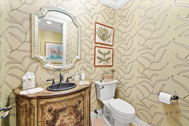 a couple of table and chairs under an umbrella