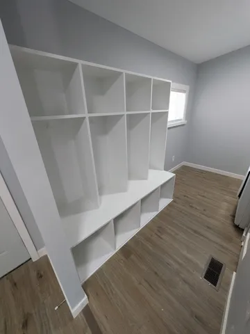 a view of an empty room and window