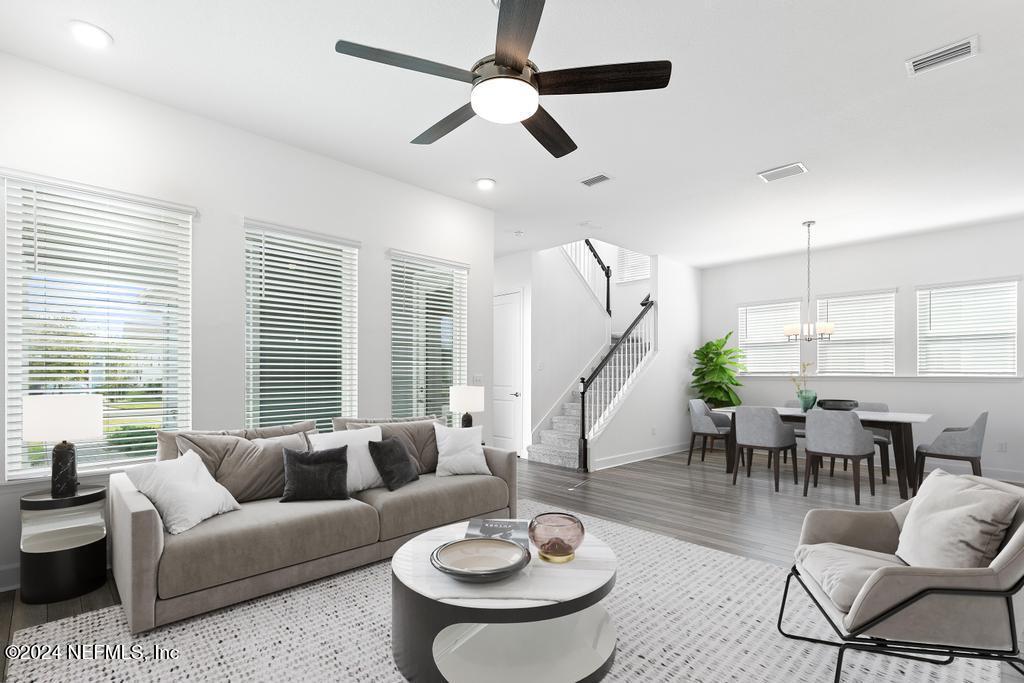116 Alston Dr Street St. Augustine, FL 32092 - Photo 19 of 58 a living room with furniture and a large window