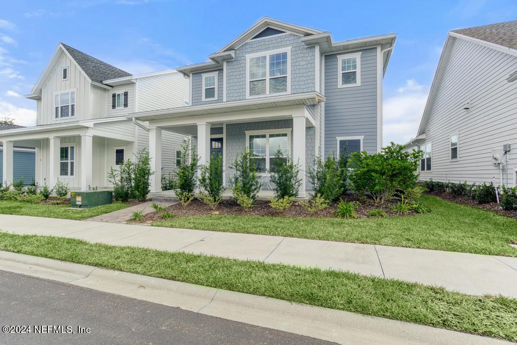 116 Alston Dr Street St. Augustine, FL 32092 - Photo 2 of 58 a front view of a house with a yard