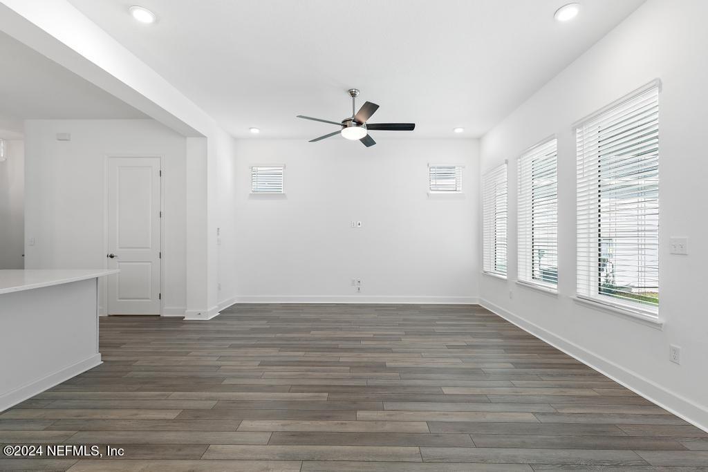 116 Alston Dr Street St. Augustine, FL 32092 - Photo 23 of 58 wooden floor in an empty room with a window
