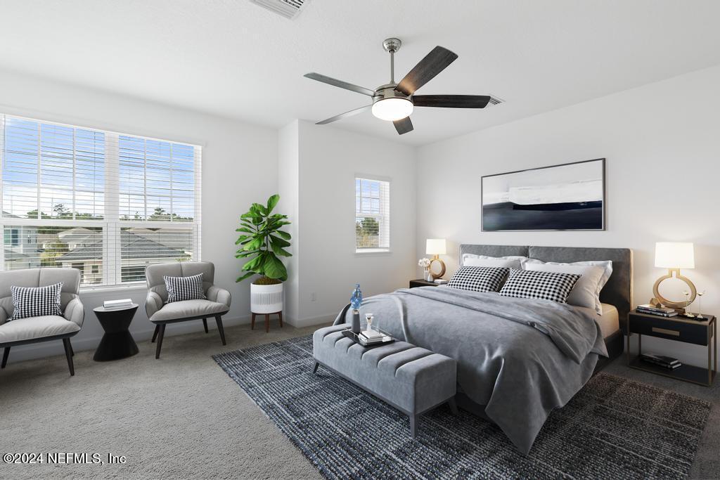 116 Alston Dr Street St. Augustine, FL 32092 - Photo 28 of 58 a bedroom with a large bed couch and a window