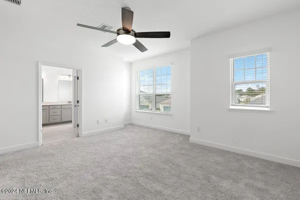 a bathroom with a shower and a shower head