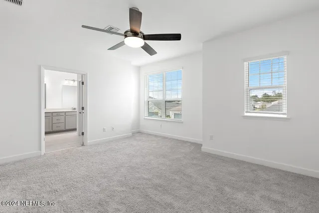 a bathroom with a shower and a shower head