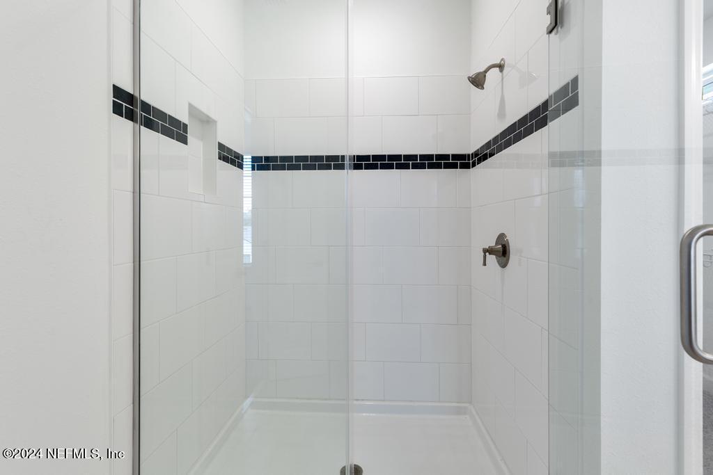116 Alston Dr Street St. Augustine, FL 32092 - Photo 32 of 58 a bathroom with a shower and a shower head