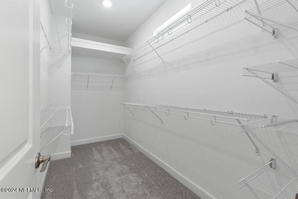 116 Alston Dr Street St. Augustine, FL 32092 - Photo 33 of 58 a view of a room with racks on the wall